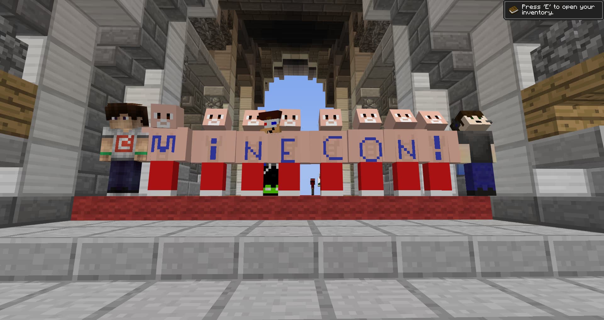 Players spell out 'MINECON!' using in-game skins.